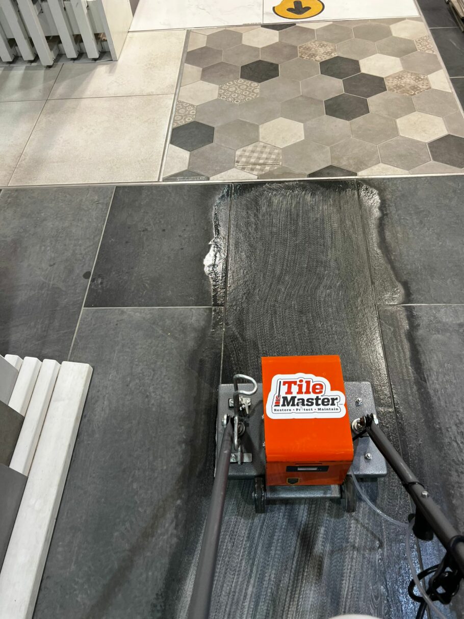 Removing grout haze from newly laid porcelain. The Tile Master